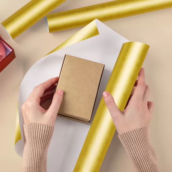 Papier do pakowania prezentów złoty z kokardą (200 x 57 cm)