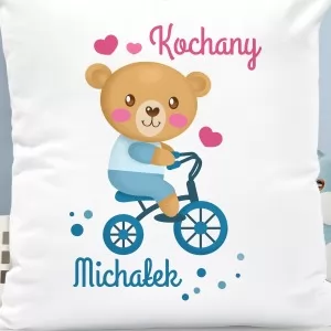 poduszka z grafika małego rowerzysty i nadrukiem imienia na prezent na mikołajki dla chłopczyka